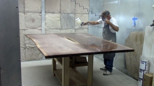 Staining a tabletop in the spray room
