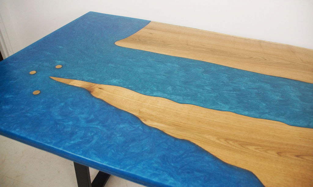 Custom Built River Table Sold Online By CVCF [Blue Epoxy Resin Water Theme Resembles A River Meeting An Ocean With Small Offshore Islands